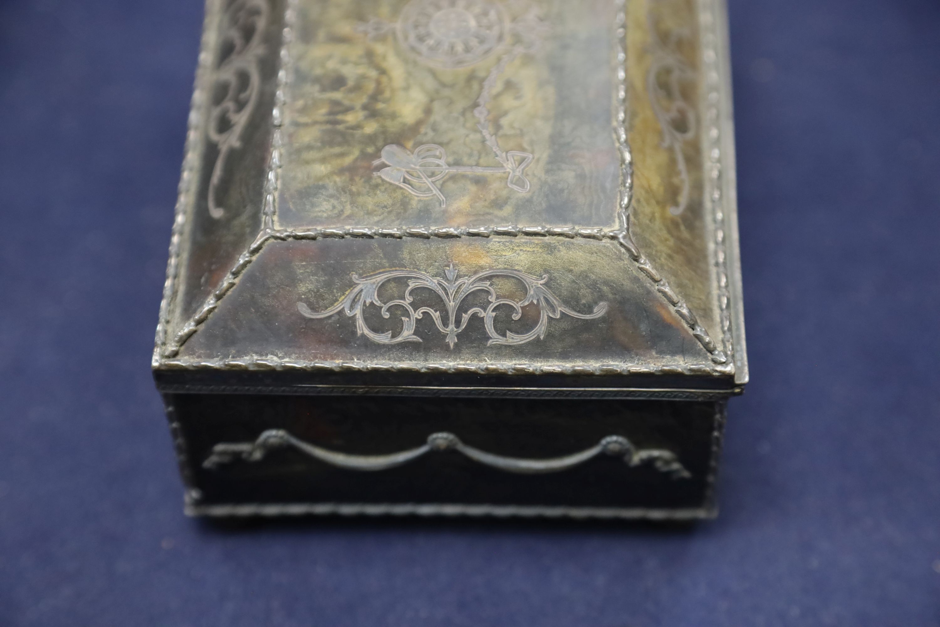 A silver-mounted tortoiseshell pique rectangular trinket box, by William Comyns, raised on four ball feet, London, 1904, width 15cm. 15cm